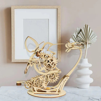 hummingbird kinetic sculpture wooden model on display shelf, animated bird figurine for living room and office decor