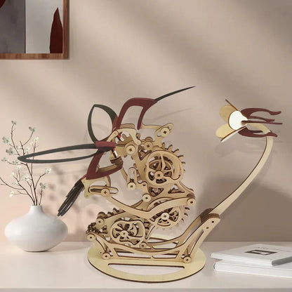 wooden kinetic sculpture kit with flapping hummingbird wings, mechanical desk art for home office and study spaces