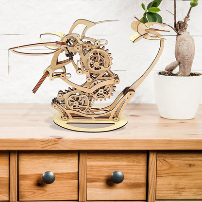 moving hummingbird sculpture in natural wood finish, kinetic decor piece for console table bookshelf or dresser top