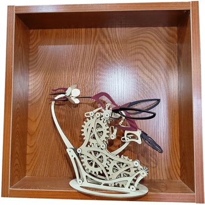 kinetic bird sculpture displayed in cube shelf, wooden mechanical hummingbird art object and conversation piece