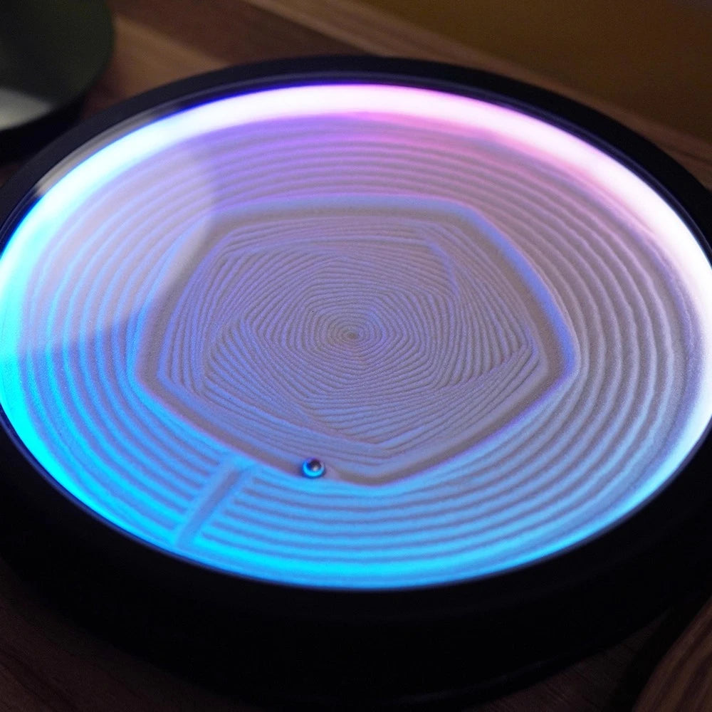 kinetic art table with a magnetic ball tracing hexagonal sand patterns, app-controlled mesmerizing desk decor and zen night light