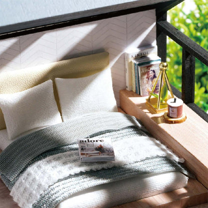 miniature apartment dollhouse blue bedroom close-up with bed magazines gallery wall art prints diy 1:24 scale craft kit — Blue