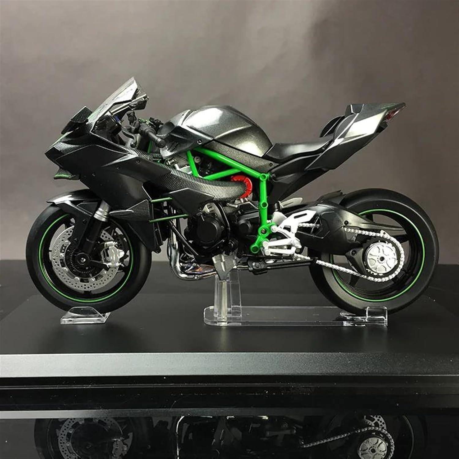 Collectible RC motorbike showing throttle control and handlebar detail, hobby display model