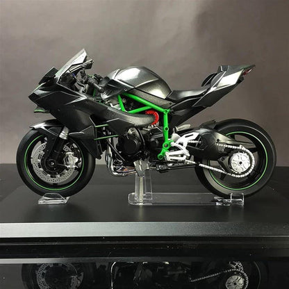Collectible RC motorbike showing throttle control and handlebar detail, hobby display model