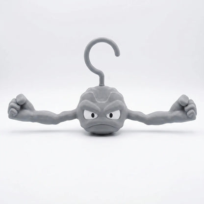 3D printed Pokemon Geodude hanger front view with muscled arms outstretched, rock monster coat hanger for Pokemon fans