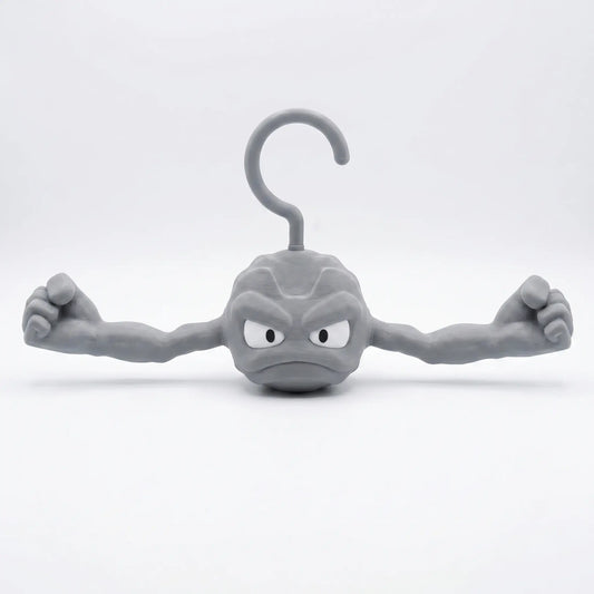 3D printed Pokemon Geodude hanger front view with muscled arms outstretched, rock monster coat hanger for Pokemon fans