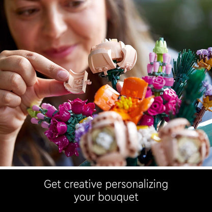 woman personalizing her diy building block bouquet by adding a brick flower, hands-on hobby kit gift for her