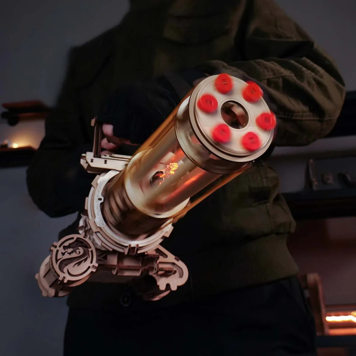 six barrel cluster of the wooden puzzle kit held in hand showing the rubber band loading faces, Rotating-Barrel
