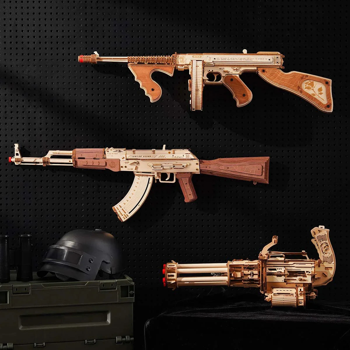 three wooden model kits mounted on a pegboard wall as a mechanical collection for hobby rooms, Rotating-Barrel+Thompson+AK-47