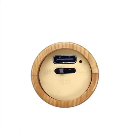 Round wooden device with USB and HDMI ports on a white background