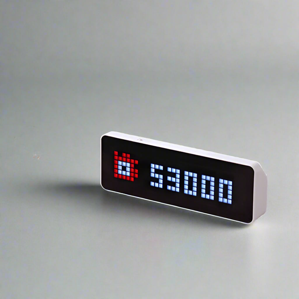 Smart pixel clock followers counter display with LED screen showing social media data, weather, and time