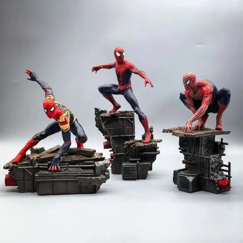 spider man statue set of three no way home suits displayed together as marvel collectible figurines for a fan shelf, Integrated Suit, Friendly Neighborhood Suit, Amazing Suit