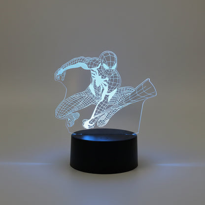 marvel superhero desk lamp lit blue beside a plant, 3d etched acrylic night light gift for a comic book fan, Spider-Man Web Shot