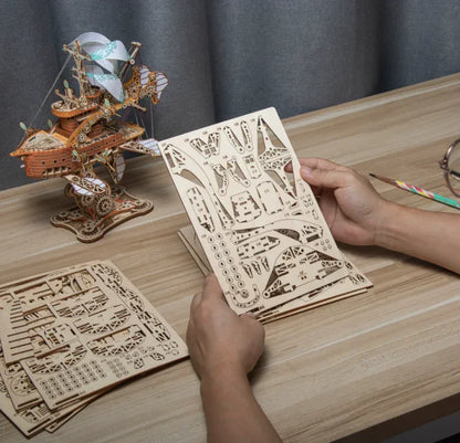 laser cut bamboo sheets and punch out parts for a wooden airship kit, adult craft project for a long weekend