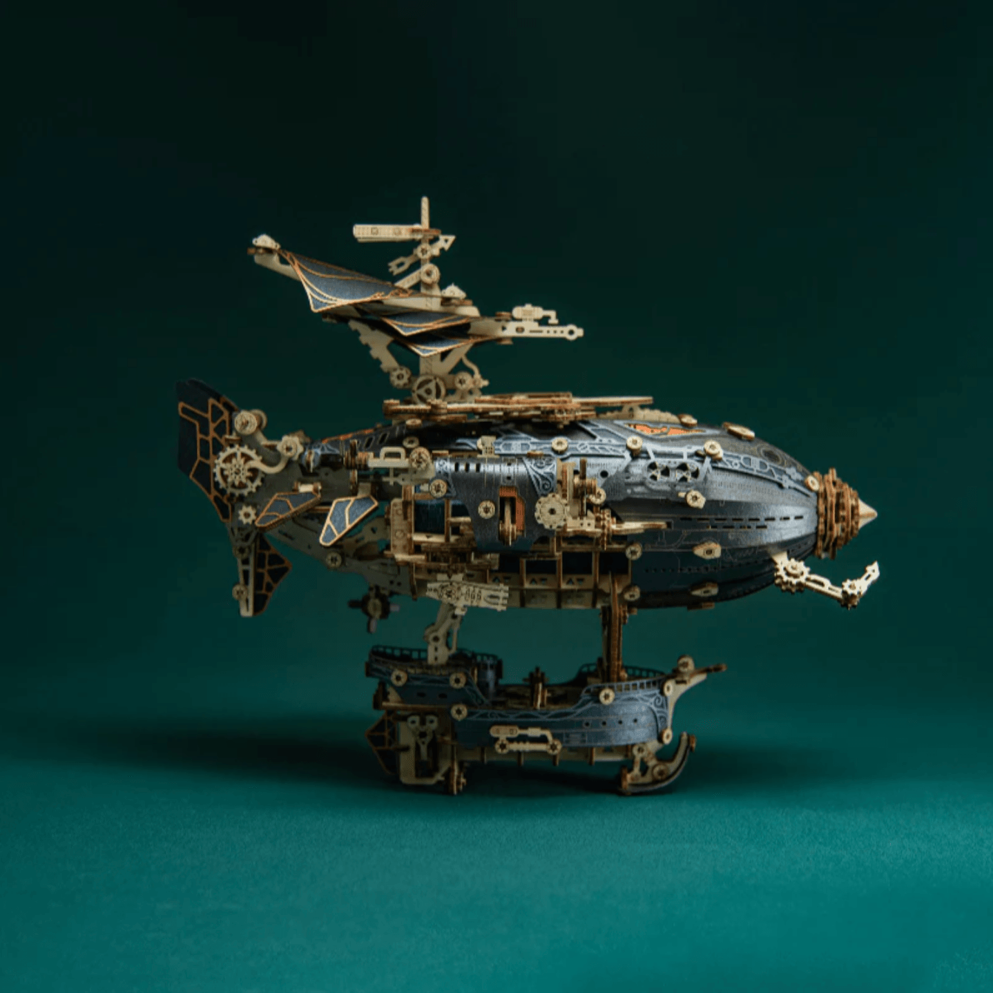 dark airship sculpture on a wooden stand, victorian machine decor for a library shelf or study desk, Blue