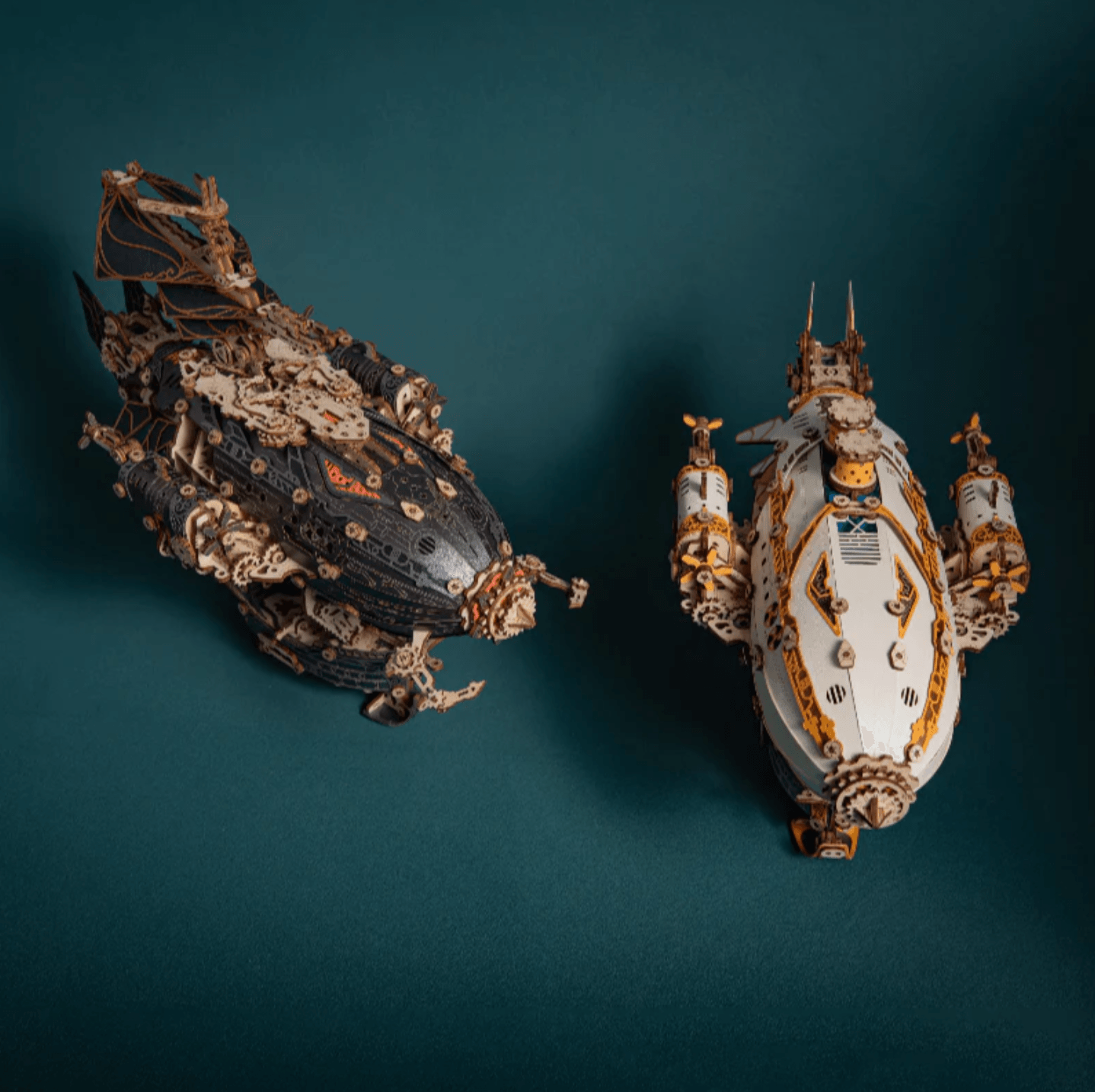 front view of both airship colourways showing hull shape and propeller placement on each model, White, Blue
