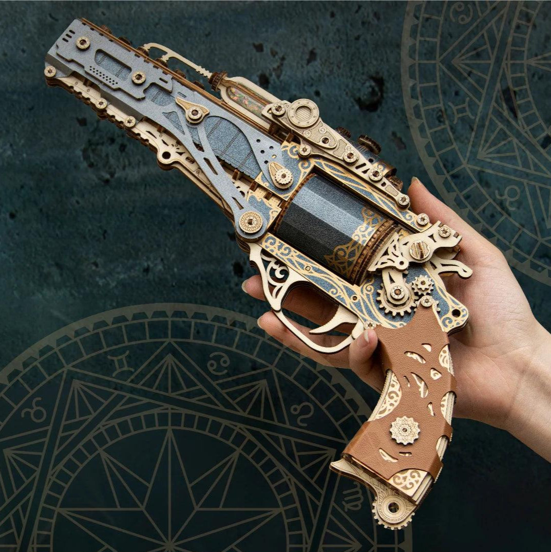Steampunk wooden revolver puzzle held in hand, scale shot of mechanical wood gun model kit for collectors — TOYGUNS-1 TOYGUNS-2 TOYGUNS-3 TOYGUNS-4 MOOD1-18580911