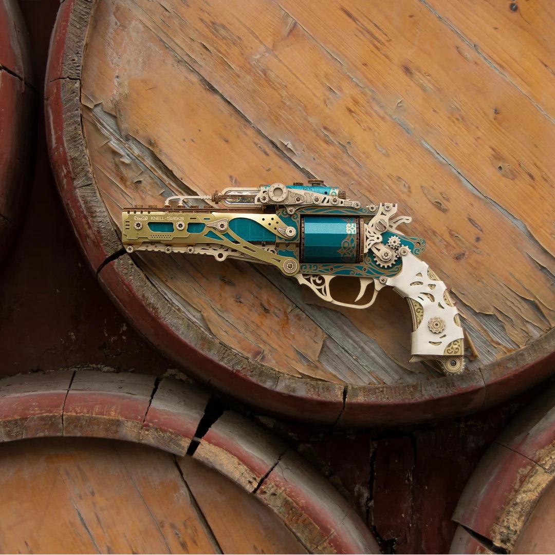 Teal wooden revolver puzzle on wooden barrels lifestyle shot, steampunk wood gun display piece for shelf decor — TOYGUNS-1 TOYGUNS-2 TOYGUNS-3 TOYGUNS-4 MOOD1-18580911
