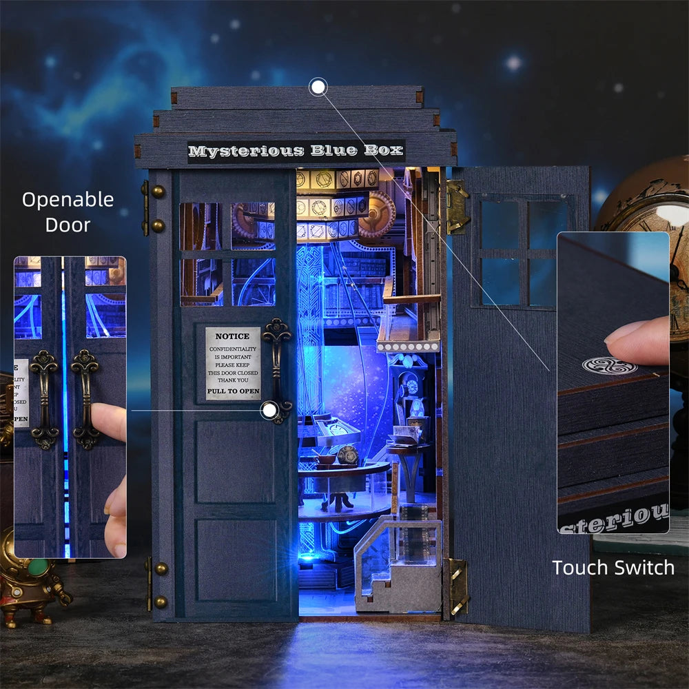 blue telephone booth book nook kit lit by warm led light showing the miniature interior through open doors