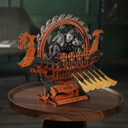 mechanical wooden ship model displayed on a walnut side table as norse themed living room and office decor